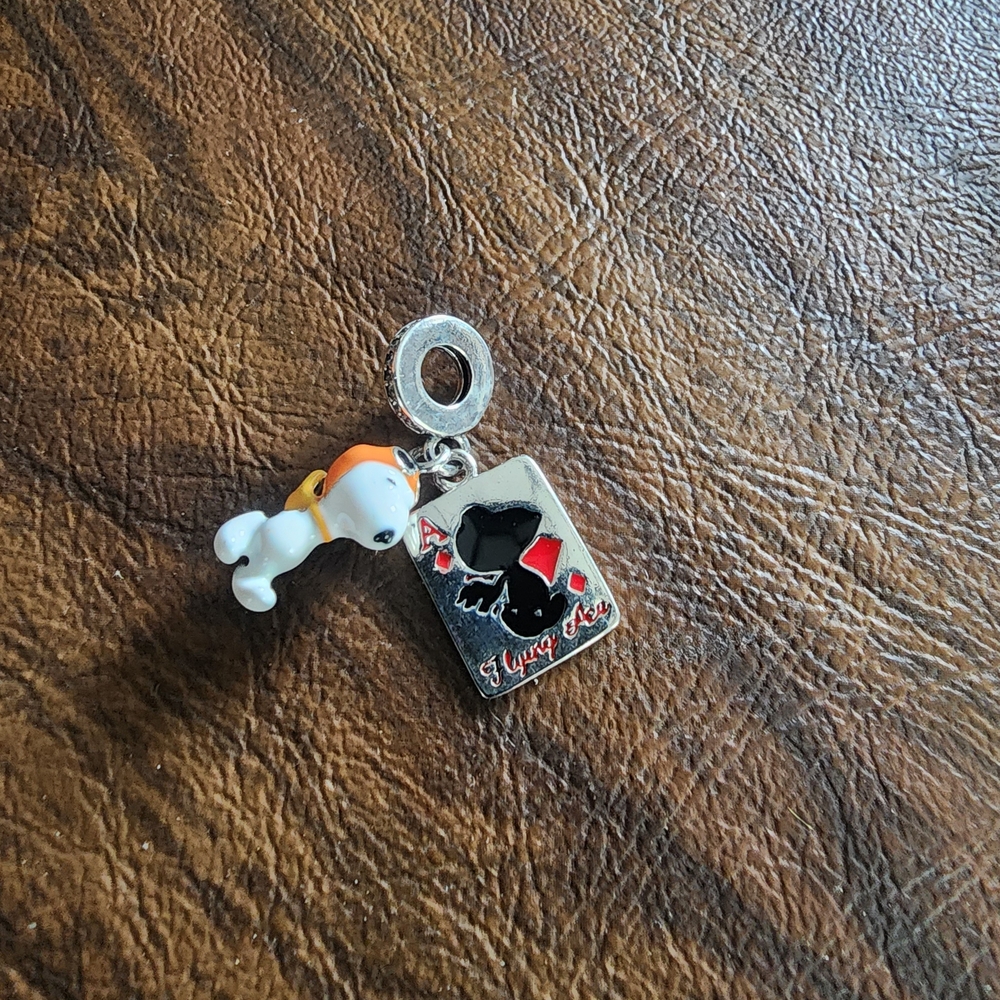 Snoopy in his ultra ego costume bracelet charm with the flying Ace card charm